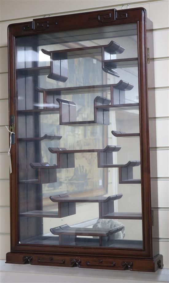 A Chinese hardwood wall mounted display cabinet W.54cm